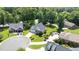 Aerial view of an upscale neighborhood and a home with a large, manicured lawn at 2333 Grey Gables Dr, Burlington, NC 27215