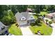 Aerial view of a home with a well-manicured front lawn and mature shade trees at 2333 Grey Gables Dr, Burlington, NC 27215