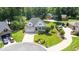 Aerial view of a home with an attached two-car garage and well-manicured front lawn at 2333 Grey Gables Dr, Burlington, NC 27215