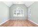 Bright bedroom with vaulted ceiling, large windows, and light green walls, creating a spacious and airy feel at 2333 Grey Gables Dr, Burlington, NC 27215