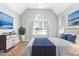 Serene staged bedroom featuring a large window and decor that creates a peaceful and inviting atmosphere at 2333 Grey Gables Dr, Burlington, NC 27215