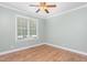 Neutral bedroom with window offering natural light, creating a calm and inviting atmosphere at 2333 Grey Gables Dr, Burlington, NC 27215