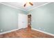 Bright bedroom with hardwood floors, spacious closet, and easy access to the adjacent bathroom at 2333 Grey Gables Dr, Burlington, NC 27215