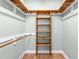 Walk-in closet with custom wooden shelving and ample storage space, providing organization and style at 2333 Grey Gables Dr, Burlington, NC 27215