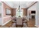 Formal dining room featuring a modern chandelier and neutral decor at 2333 Grey Gables Dr, Burlington, NC 27215
