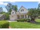 Charming two-story home with a well-manicured lawn, attached garage, and brick accents at 2333 Grey Gables Dr, Burlington, NC 27215