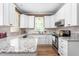 Well-lit kitchen featuring granite counters and modern appliances at 2333 Grey Gables Dr, Burlington, NC 27215