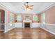Spacious living room features a cozy fireplace and custom built-in cabinets at 2333 Grey Gables Dr, Burlington, NC 27215