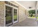 An inviting porch with light brick and view to backyard at 2333 Grey Gables Dr, Burlington, NC 27215