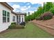 Large backyard with lush landscaping, and patio area, perfect for outdoor entertaining and relaxation at 236 Lucky Ribbon Ln, Holly Springs, NC 27540