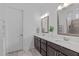 Elegant bathroom with double vanity, quartz countertops, and modern fixtures at 236 Lucky Ribbon Ln, Holly Springs, NC 27540