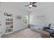 Neutral bedroom with white trim, light carpet, a window with view, and decor at 236 Lucky Ribbon Ln, Holly Springs, NC 27540