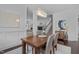 Stylish dining room with a contemporary chandelier and easy access to other living areas at 236 Lucky Ribbon Ln, Holly Springs, NC 27540