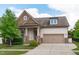 Beautifully landscaped home with a two-car garage and a welcoming covered porch at 236 Lucky Ribbon Ln, Holly Springs, NC 27540