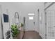 Bright foyer with hardwood floors, high ceilings, and elegant decor at 236 Lucky Ribbon Ln, Holly Springs, NC 27540