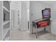 Hallway features neutral colors, light carpet, and a pinball machine at 236 Lucky Ribbon Ln, Holly Springs, NC 27540