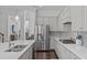 Spacious kitchen with stainless steel appliances, gray cabinetry and granite countertops at 236 Lucky Ribbon Ln, Holly Springs, NC 27540