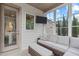 Relaxing screened porch features comfortable seating, a mounted television, and lots of natural light from large windows at 236 Lucky Ribbon Ln, Holly Springs, NC 27540