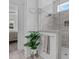 Stylish walk-in shower with gray tiling, glass enclosure, and modern showerhead at 236 Lucky Ribbon Ln, Holly Springs, NC 27540