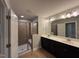 Bathroom features double sinks, tiled floor and a glass enclosed shower at 238 Alamosa Pl, Cary, NC 27519