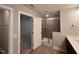 Bathroom featuring shower, vanity with white sink, and tile floor and walls at 238 Alamosa Pl, Cary, NC 27519