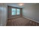 Cozy bedroom features plush carpeting and large windows providing natural light at 238 Alamosa Pl, Cary, NC 27519