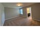 Bedroom with carpet, neutral walls, a window, and an ensuite bathroom at 238 Alamosa Pl, Cary, NC 27519