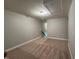 Neutrally painted bonus room is carpeted and well lit with an access panel at 238 Alamosa Pl, Cary, NC 27519