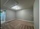 Spacious carpeted bonus room with neutral paint and an access panel at 238 Alamosa Pl, Cary, NC 27519