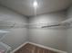 Walk-in closet with wire shelving, carpet, and neutral walls at 238 Alamosa Pl, Cary, NC 27519