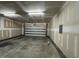 Spacious garage with concrete floor, overhead lighting, and an automatic door at 238 Alamosa Pl, Cary, NC 27519