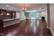 Open floor plan connecting the kitchen, living room and staircase with hardwood flooring throughout the home at 238 Alamosa Pl, Cary, NC 27519