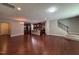 Open floor plan showcasing hardwood floors, modern kitchen, and a staircase at 238 Alamosa Pl, Cary, NC 27519
