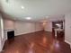 Spacious living room featuring a fireplace and open floor plan with hardwood flooring and recessed lighting at 238 Alamosa Pl, Cary, NC 27519