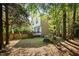 Lush backyard with privacy fencing, framed by mature trees, creating a serene outdoor space at 2418 Mont Haven Dr, Durham, NC 27712