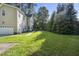 Spacious backyard with lush green lawn, offering plenty of room for outdoor activities at 2418 Mont Haven Dr, Durham, NC 27712