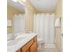 Bathroom featuring light wood vanity with white sink and shower at 2418 Mont Haven Dr, Durham, NC 27712