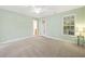 Bedroom with two windows, carpet, and natural light at 2418 Mont Haven Dr, Durham, NC 27712
