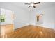 Spacious dining room filled with natural light featuring hardwood floors and open access to other rooms at 2418 Mont Haven Dr, Durham, NC 27712