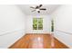 Bright dining room featuring hardwood floors, white walls, and a ceiling fan at 2418 Mont Haven Dr, Durham, NC 27712