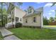 Charming two-story home with a well-maintained lawn and inviting front porch at 2418 Mont Haven Dr, Durham, NC 27712