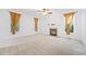 Light-filled living room with fireplace, ceiling fan and well-lit by natural light at 2418 Mont Haven Dr, Durham, NC 27712