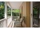 Inviting covered porch with seating, offering a relaxing outdoor space at 2418 Mont Haven Dr, Durham, NC 27712