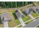 Drone shot showcasing a home with well-maintained landscaping and a long driveway at 2730 Spring Valley Dr, Creedmoor, NC 27522