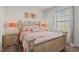 Cozy bedroom featuring neutral colors, and a window that lets in natural light at 2730 Spring Valley Dr, Creedmoor, NC 27522