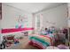 A bedroom with cute decor, pops of color, play furniture, and comfortable bedding at 2730 Spring Valley Dr, Creedmoor, NC 27522