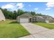 Inviting single-Gathering home with a well-manicured lawn, a concrete driveway, and a two-car garage at 2730 Spring Valley Dr, Creedmoor, NC 27522