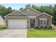 Charming single-Gathering home with a two-car garage, stone accents, and well-maintained landscaping at 2730 Spring Valley Dr, Creedmoor, NC 27522