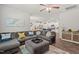 Open-concept living area featuring a large sectional sofa and seamless flow to the kitchen at 2730 Spring Valley Dr, Creedmoor, NC 27522