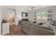 Comfortable living room with a large TV, plush sectional, and view into the bedroom at 2730 Spring Valley Dr, Creedmoor, NC 27522